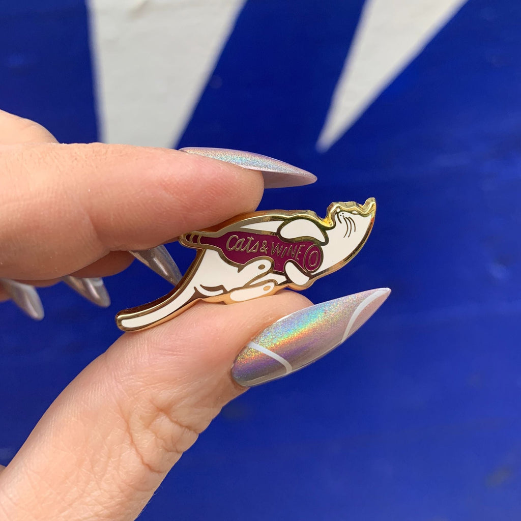 Cats and Wine Make Everything Fine Enamel Pin in Purplish Red and Gold by The Bullish Store