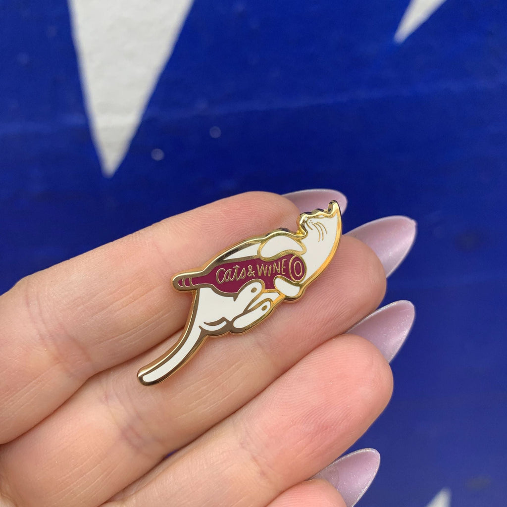Cats and Wine Make Everything Fine Enamel Pin in Purplish Red and Gold by The Bullish Store