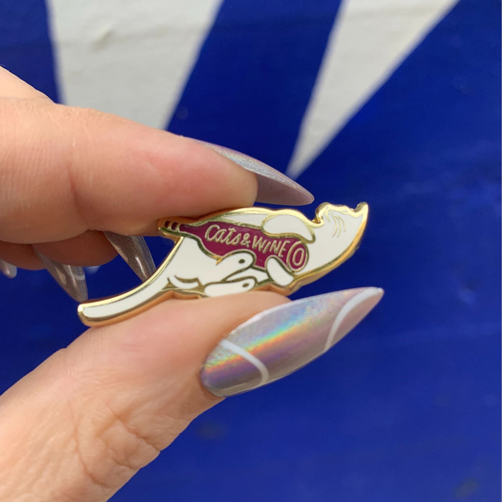Cats and Wine Make Everything Fine Enamel Pin in Purplish Red and Gold by The Bullish Store