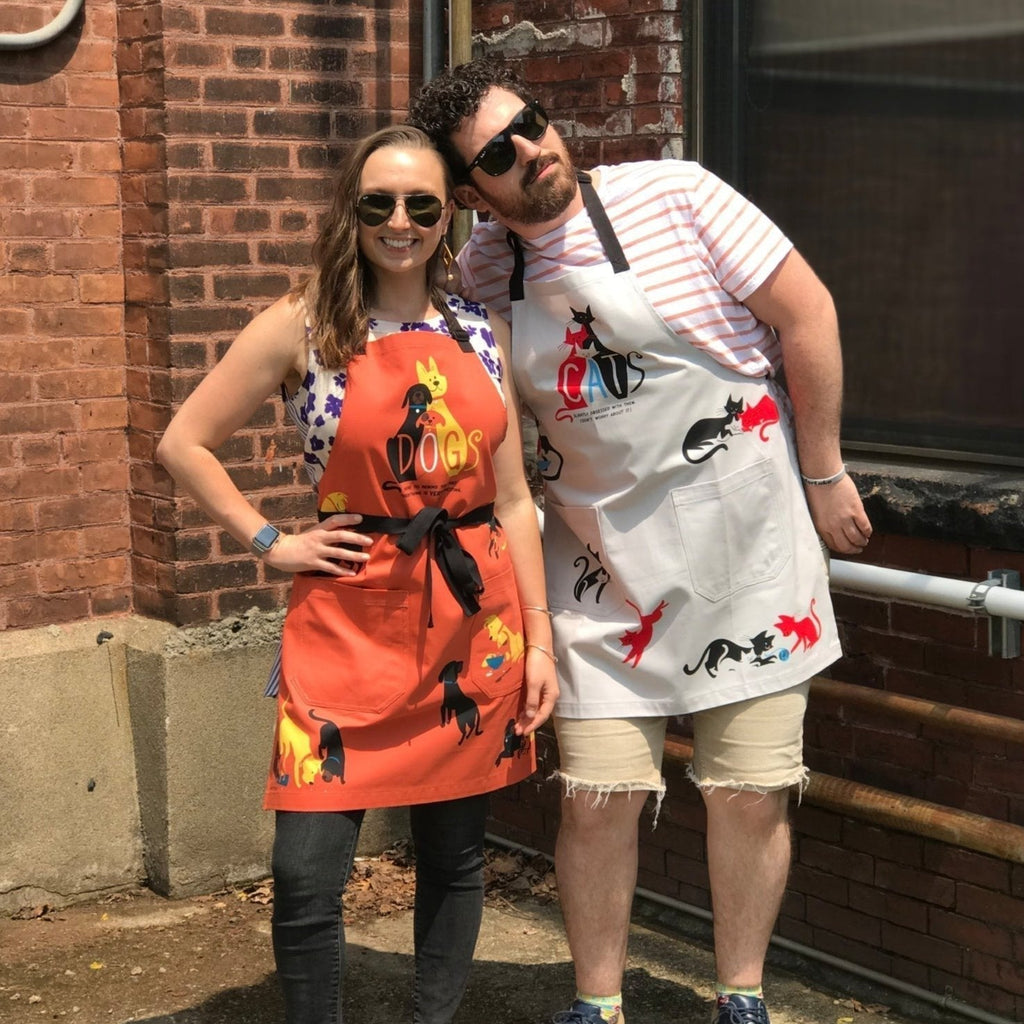 Dogs. Here To Remind You That Everything Is Exciting Funny Cooking and BBQ Apron Unisex 2 Pockets Adjustable Strap 100% Cotton | BlueQ at GetBullish by The Bullish Store