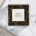 Never Give Up 3"x3" Paperweight | Black Geometric Pattern by The Bullish Store
