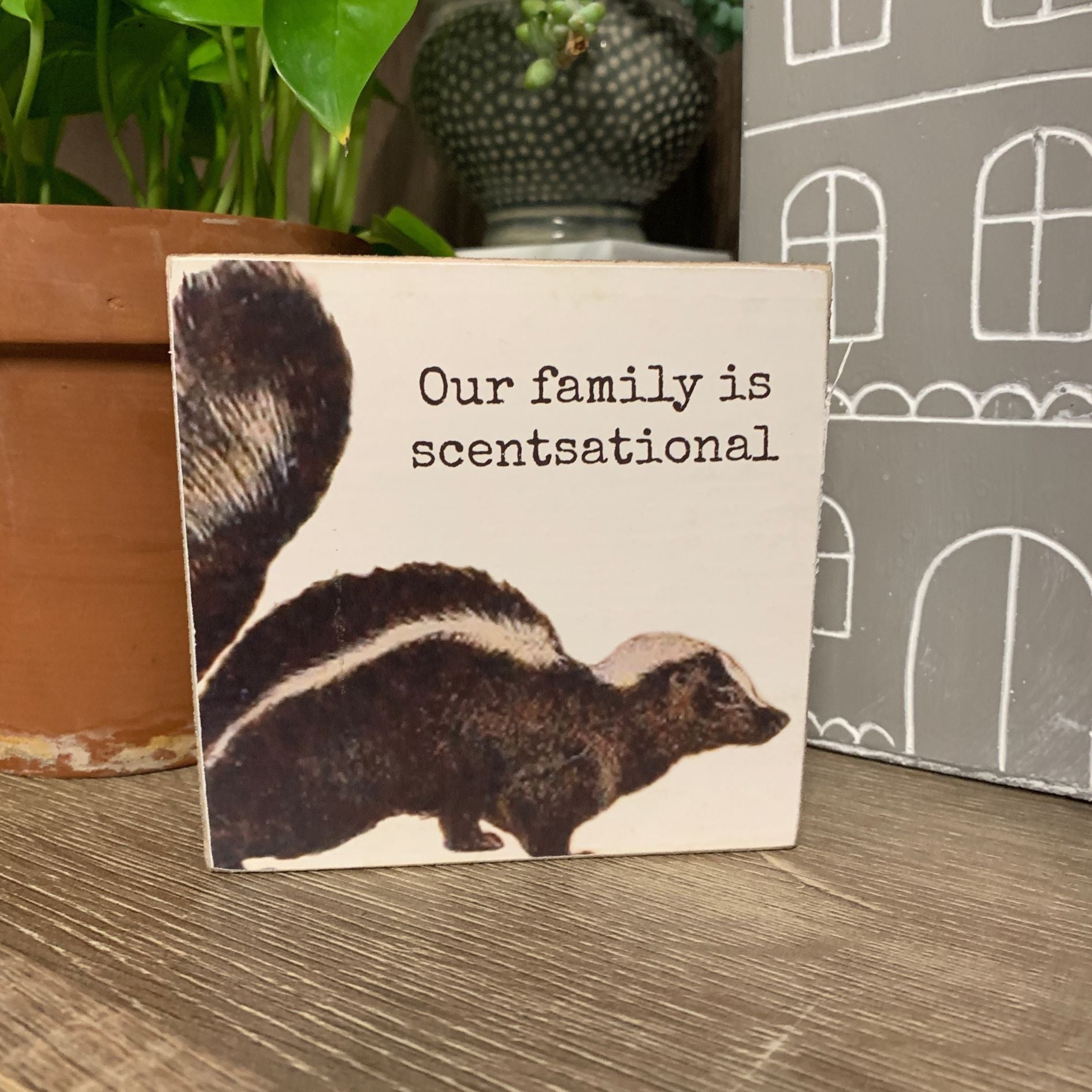 Our Family Is Scentsational Skunk Motif Punny Wooden Block Sign | 4" x 4" by The Bullish Store